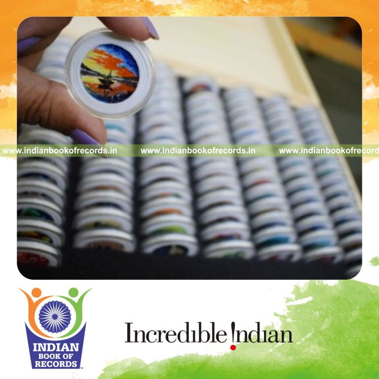 multiple miniature paintings created on one rupee indian coins by an individual for a record in Indian Book of Records