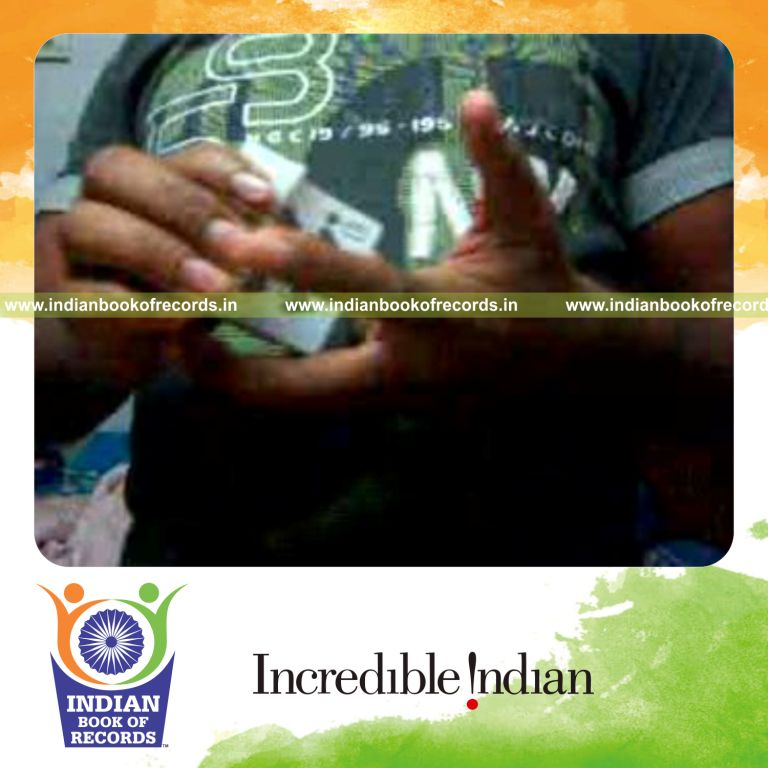 individual performing maximum muse card cuts in one minute for record in Indian Book of Records