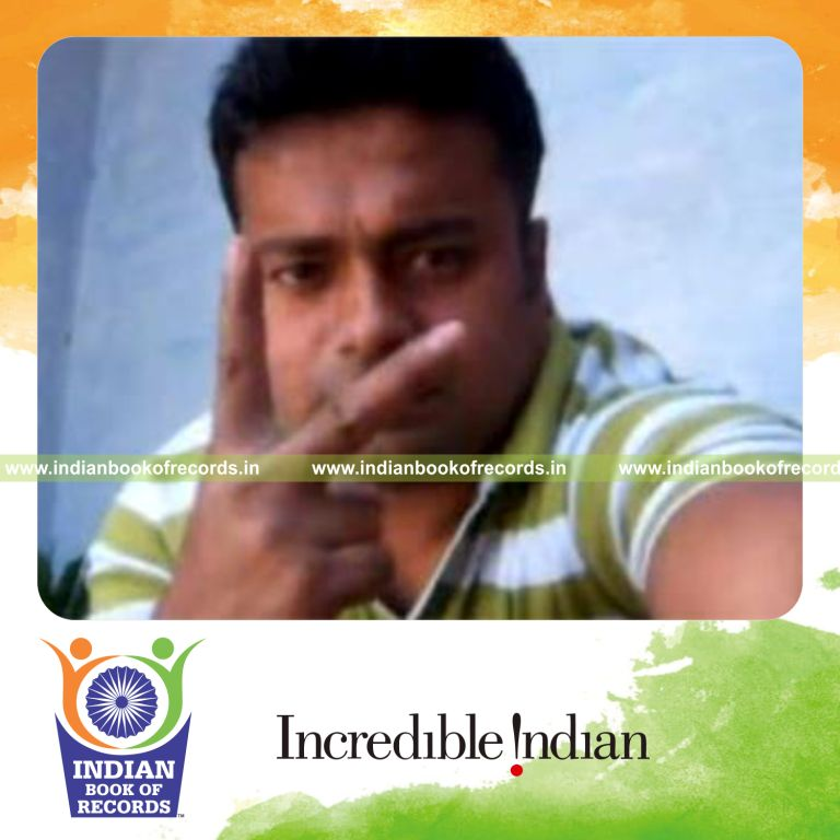 individual performing muse card cuts while holding 20 pound weight plate for record in Indian Book of Records