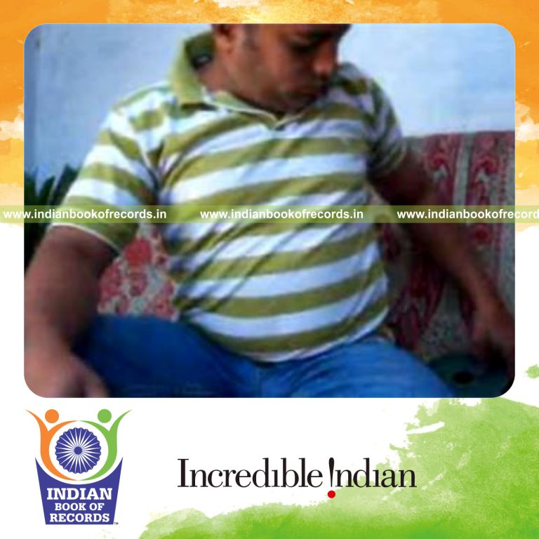 individual performing muse card cuts while holding weight plates for record in Indian Book of Records