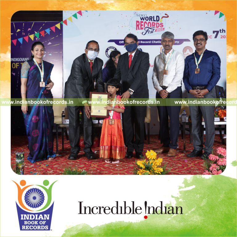 A young child identifying various musical instruments from flashcards within a short time for Indian Book of Records