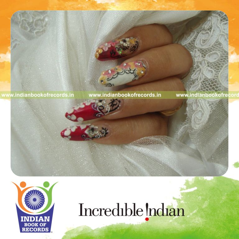 female creating multiple nail art designs for Indian Book of Records