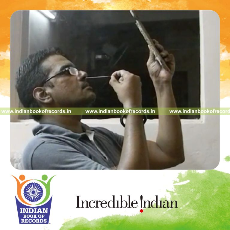 individual inserting nail into nose multiple times in 30 seconds for record in Indian Book of Records