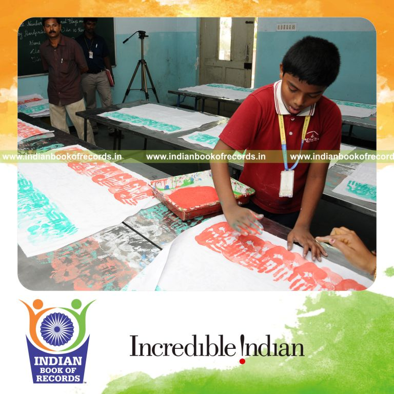 young male creating national flags using handprints within ten hours for record in Indian Book of Records