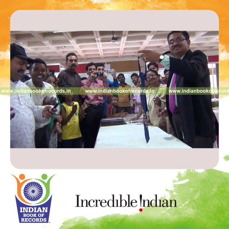 male individual collecting neckties for record in Indian Book of Records