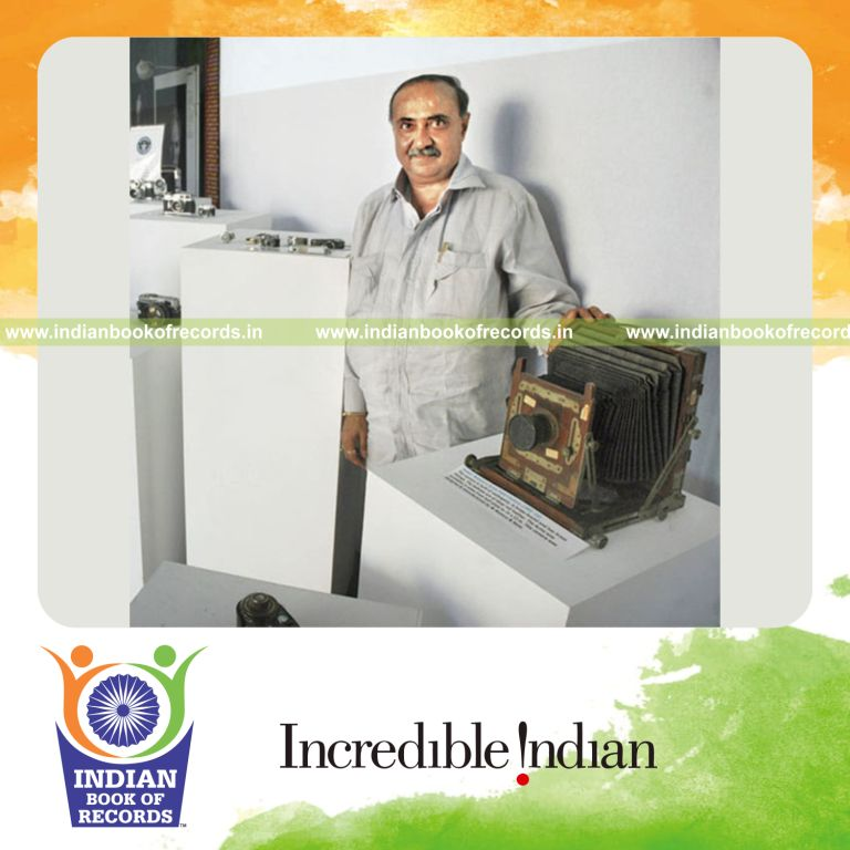 male individual collecting multiple cameras for record in Indian Book of Records