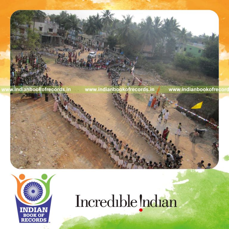 group of children participating in ribbon cutting simultaneously at single venue for record in Indian Book of Records