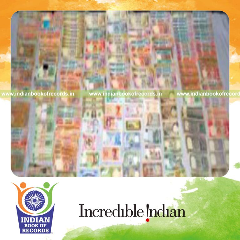 male individual collecting currency notes with unique series for record in Indian Book of Records