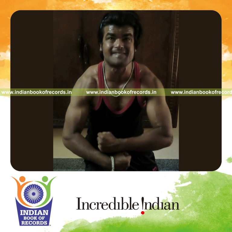 male individual crushing helmets within one minute for record in Indian Book of Records