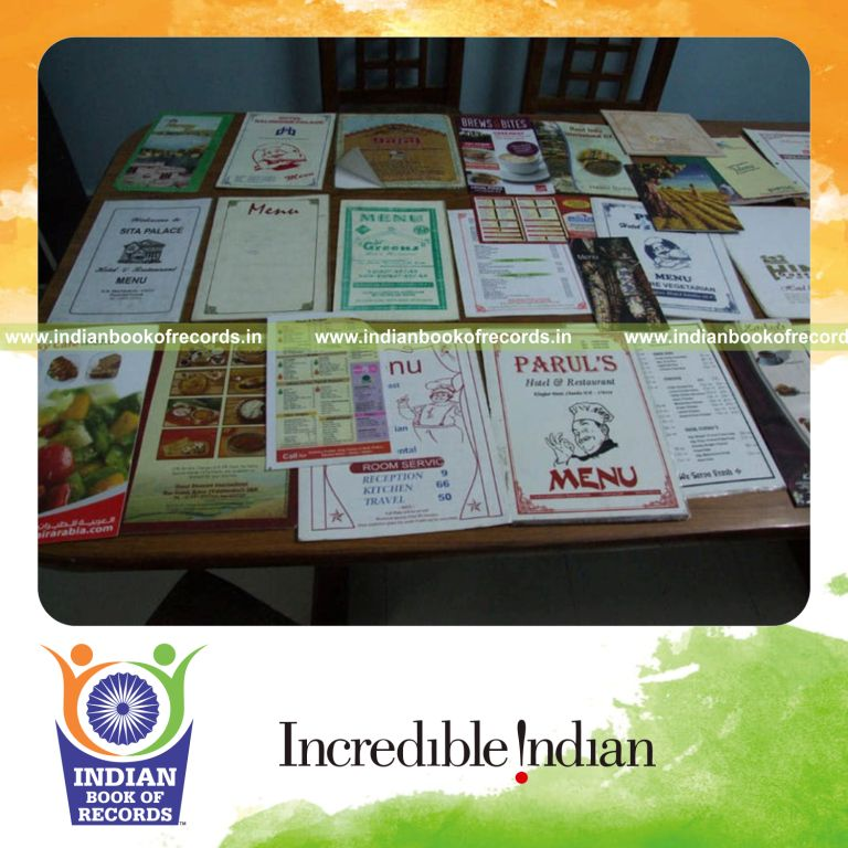 female individual collecting multiple hotel menu cards for record in Indian Book of Records