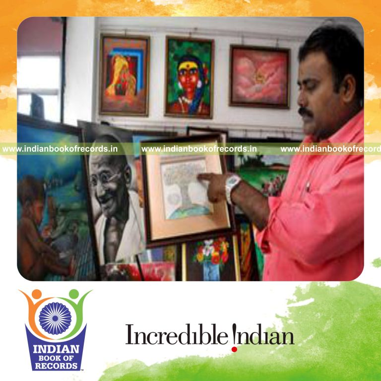 male individual creating multiple micro tip paintings for record in Indian Book of Records