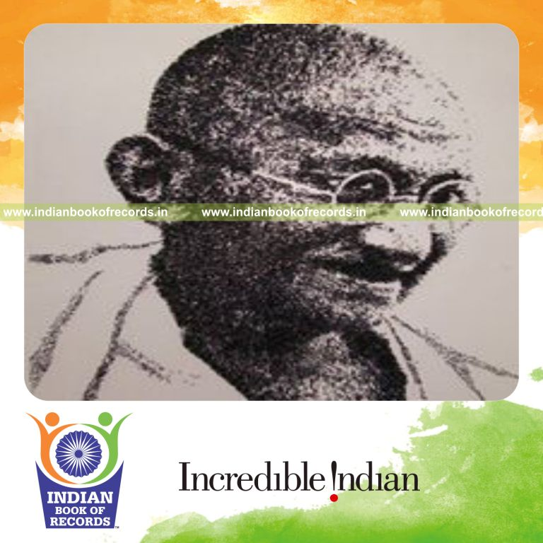 male individual creating portrait using nails for record in Indian Book of Records