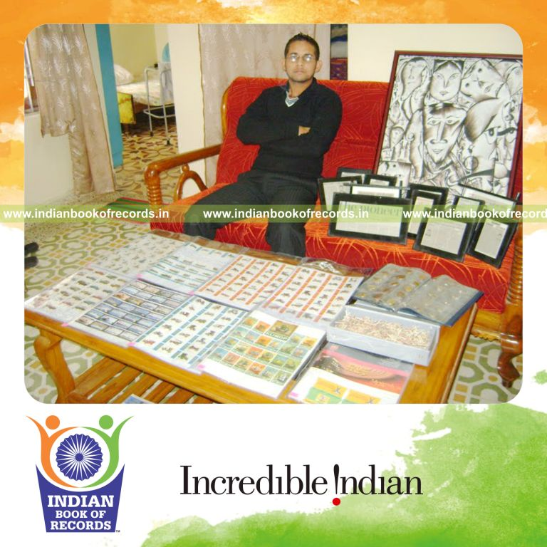 male individual creating paintings inside matchbox sliders within 111 minutes for record in Indian Book of Records