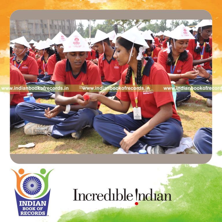 group of people exchanging flowers at single venue for record in Indian Book of Records