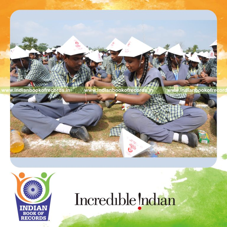 group of people exchanging friendship bands at single venue for record in Indian Book of Records