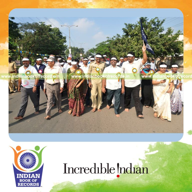 group of people walking barefoot simultaneously for record in Indian Book of Records