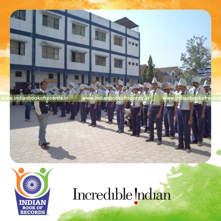 group of people wearing paper hats simultaneously at single venue for record in Indian Book of Records