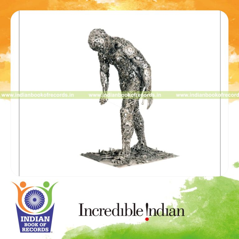 male individual creating sculptures using waste materials for record in Indian Book of Records