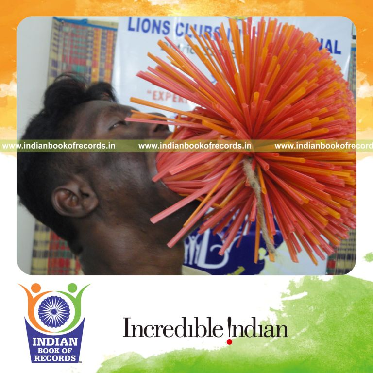male individual stuffing multiple straws in mouth for record in an Indian Book of Records