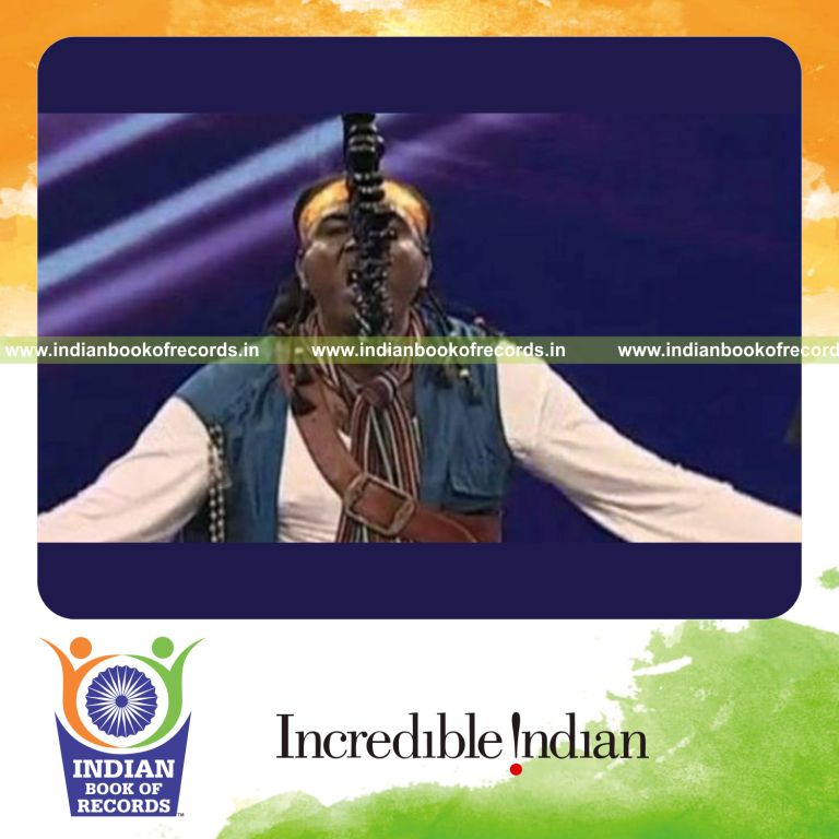 male individual performing sword swallowing act for record in Indian Book of Records
