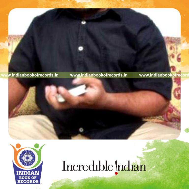 individual performing one handed full flips of top card in 30 seconds for record in Indian Book of Records