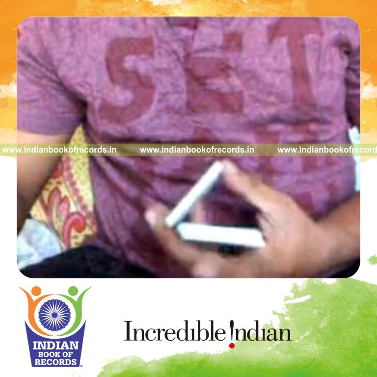 individual performing one handed charlier card cuts in 30 seconds for record in Indian Book of Records