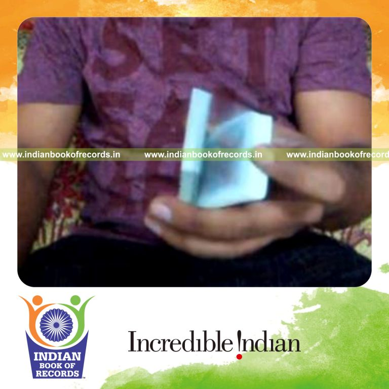 individual performing one handed charlier card cuts in one minute for record in Indian Book of Records
