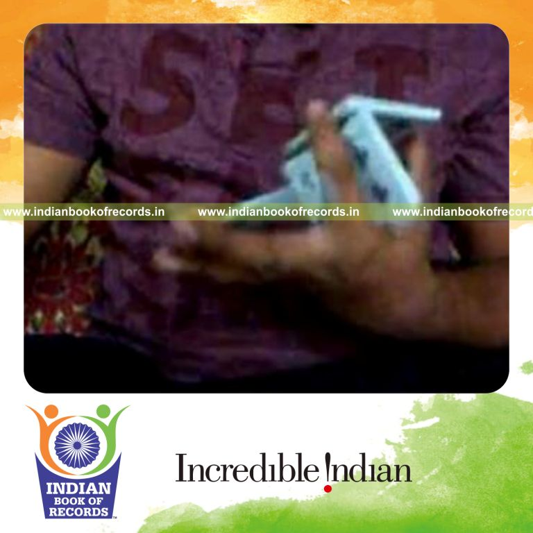 individual performing one handed kryptonite triple card cuts in one minute for record in Indian Book of Records
