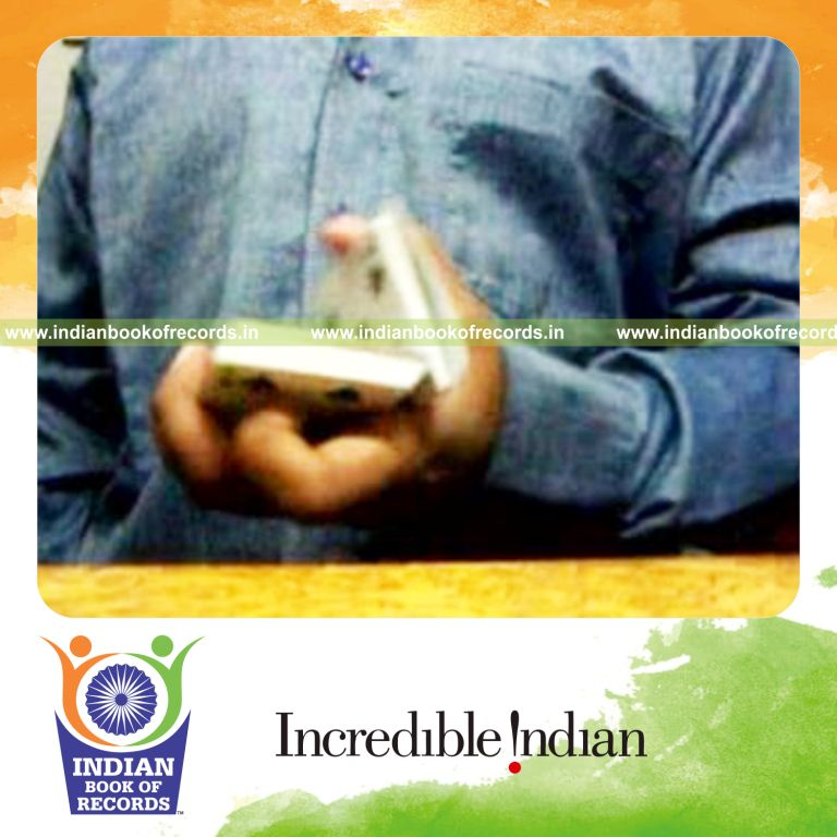 individual performing maximum one handed thumb cuts in one minute for record in Indian Book of Records