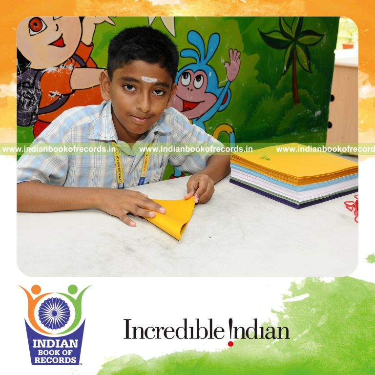 young male creating origami models within six hours for record in Indian Book of Records
