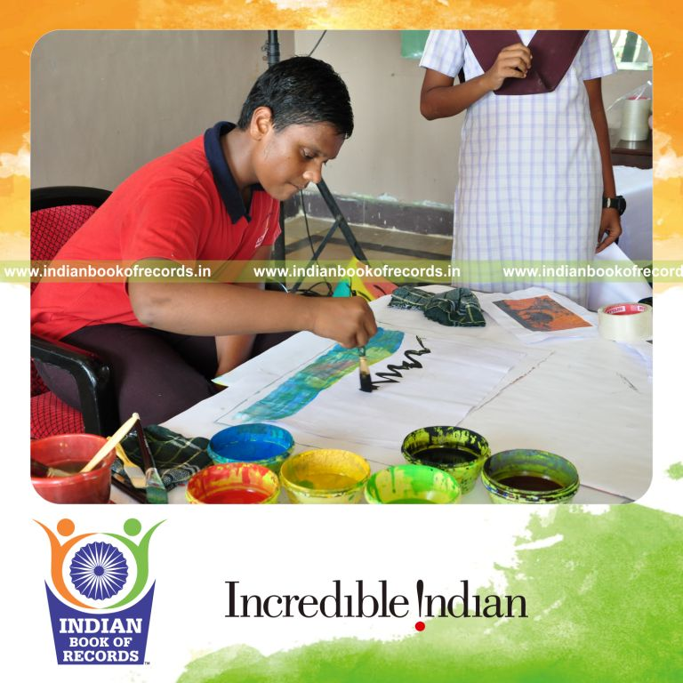 young male creating paintings within ten hours for record in Indian Book of Records