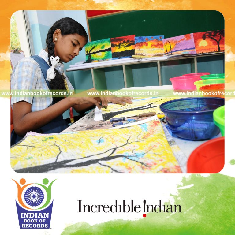 young female creating paintings using oil pastels within ten hours for record in Indian Book of Records