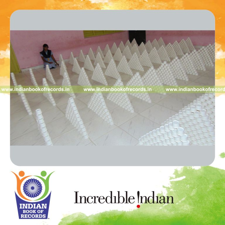 minor female building paper cup pyramids for Indian Book of Records