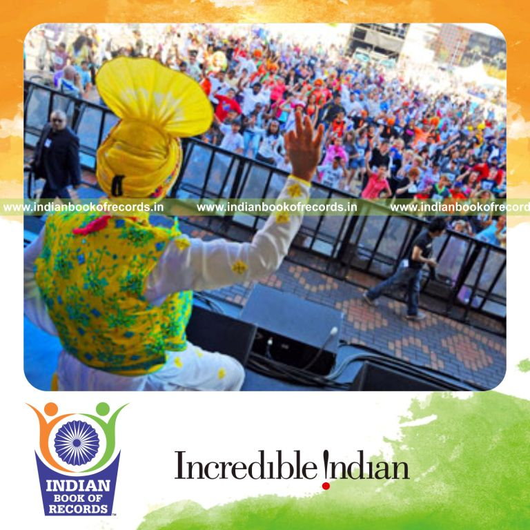 group of participants performing bhangra dance simultaneously at single venue for record in Indian Book of Records