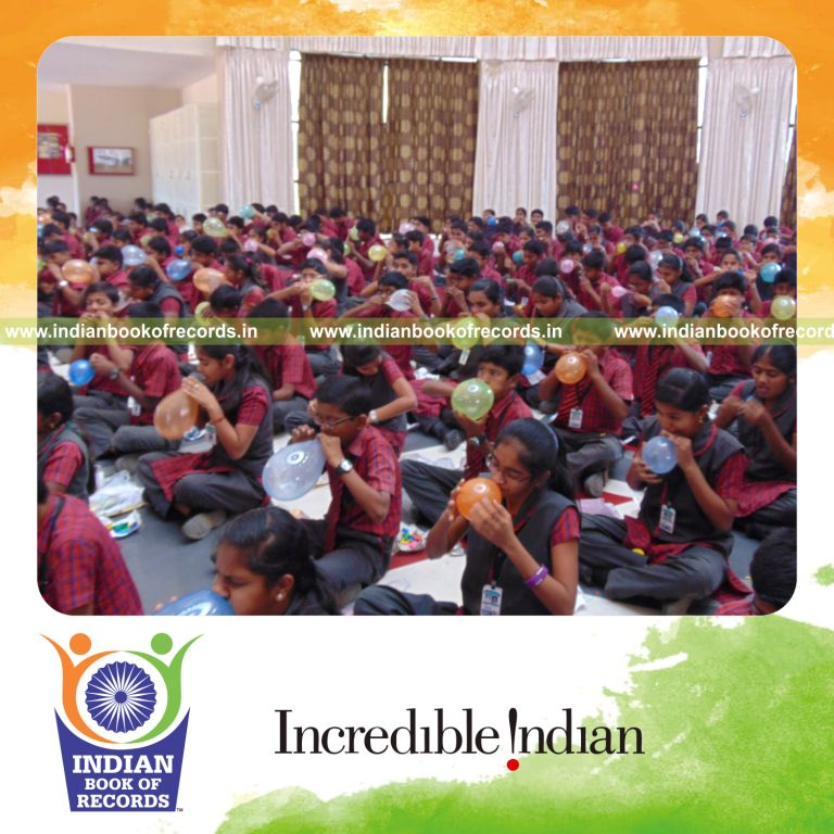 group blowing and bursting balloons simultaneously for Indian Book of Records