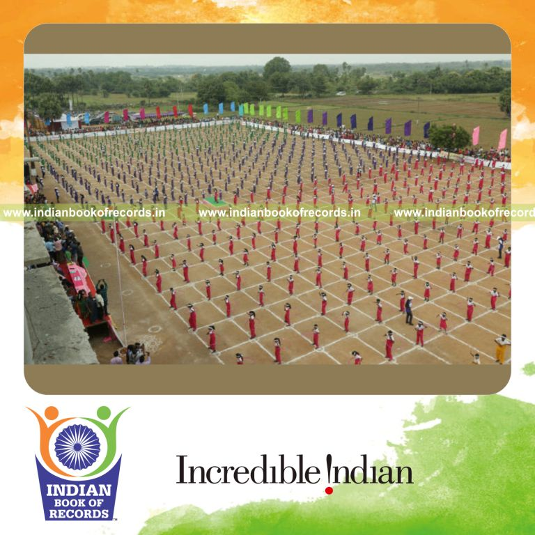 people dancing with hula hoops together at the same time in a coordinated activity for a record in Indian Book of Records