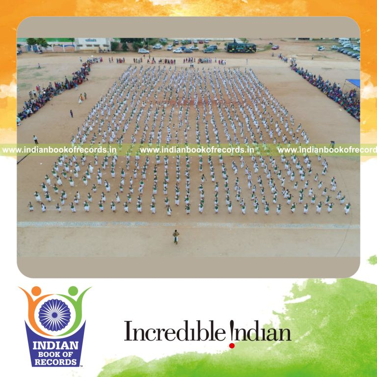 performers dancing with swords together in synchronization during a cultural performance for a record in Indian Book of Records