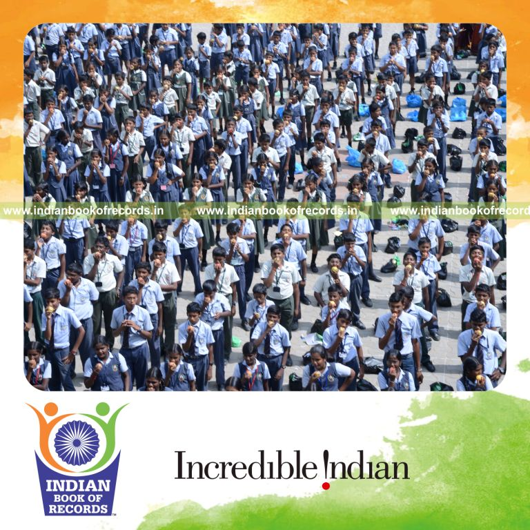 group eating apples simultaneously at single venue for Indian Book of Records