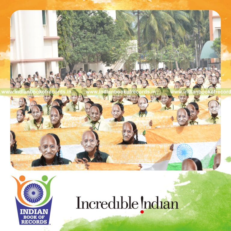 group wearing mahatma gandhi masks simultaneously for Indian Book of Records