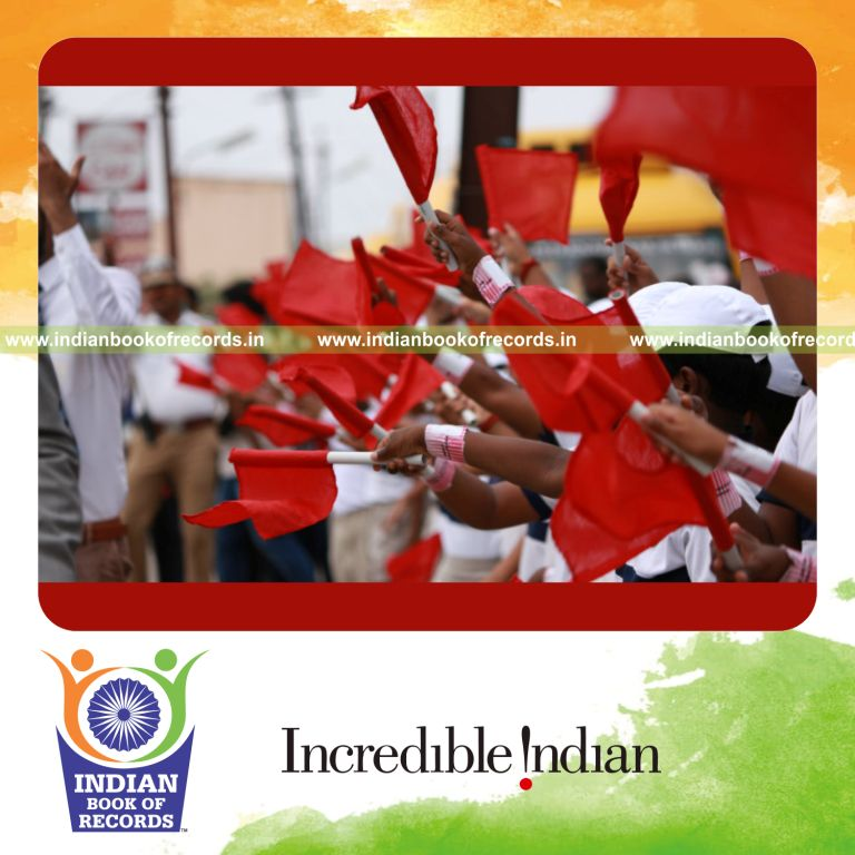 people waving traffic safety flags together at the same time to promote awareness for a record in Indian Book of Records