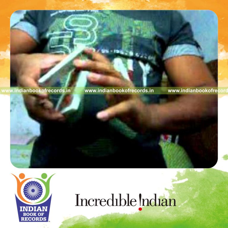 individual performing maximum pivot wave card cuts in one minute for record in Indian Book of Records