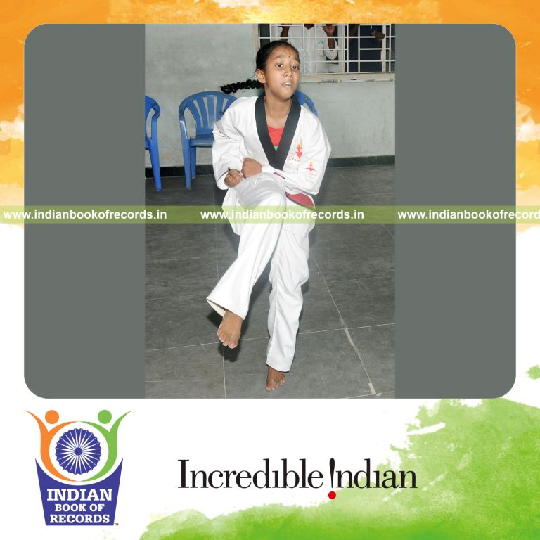 young female performing poomsae taekwondo within thirty minutes for record in Indian Book of Records