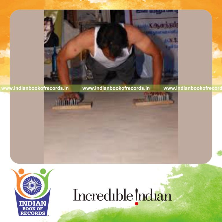 male individual performing push ups on nails bed within thirty seconds for record in Indian Book of Records