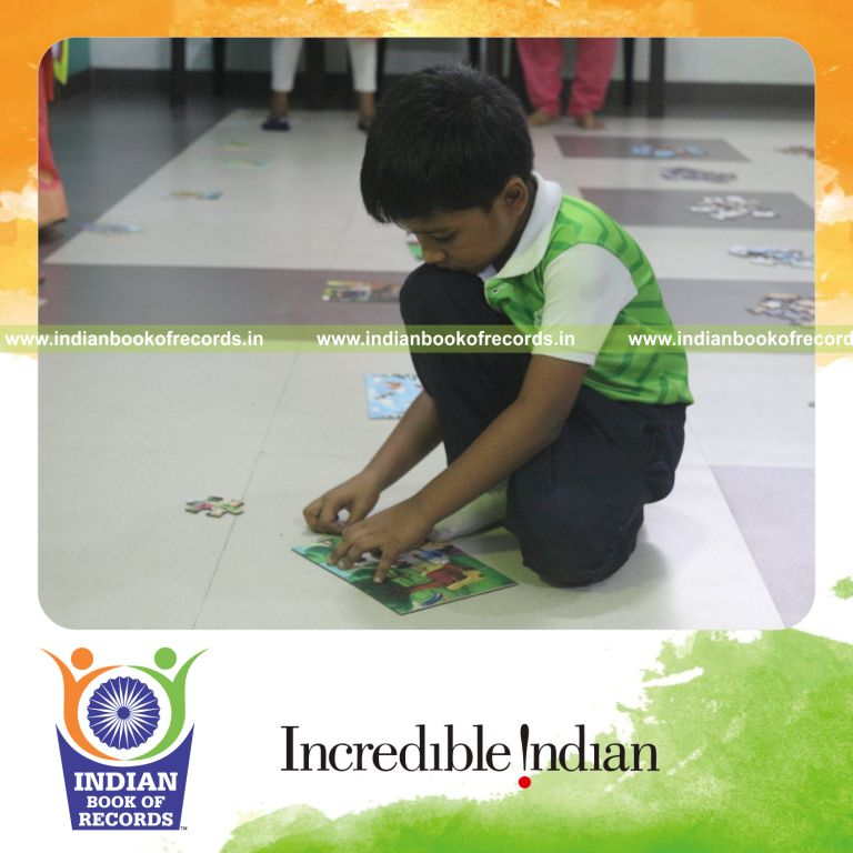A young participant solving multiple puzzles quickly within a limited time recognized by Indian Book of Records
