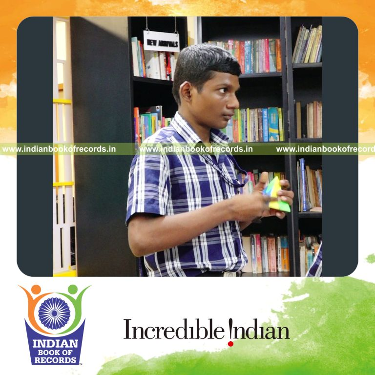 A participant solving a pyraminx puzzle repeatedly at high speed within a timed session for Indian Book of Records