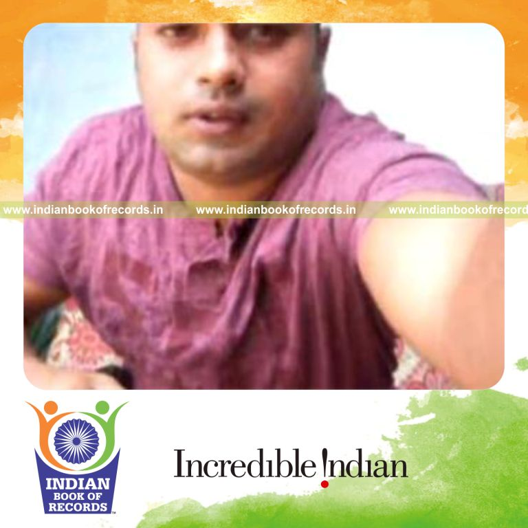 individual performing reverse scissor card cuts while holding 20 pound weight plate for record in Indian Book of Records