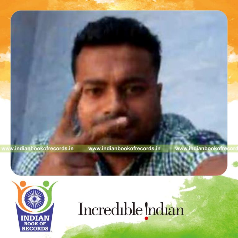 individual performing reverse scissor card cuts while holding two weight plates for record in Indian Book of Records