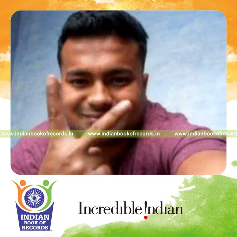 individual performing revolution card cuts while holding weight plates for an record in Indian Book of Records