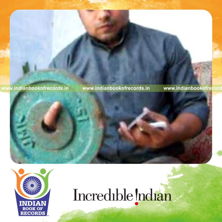 individual performing revolution 2 and chen ka combination while holding weight plate for record in Indian Book of Records