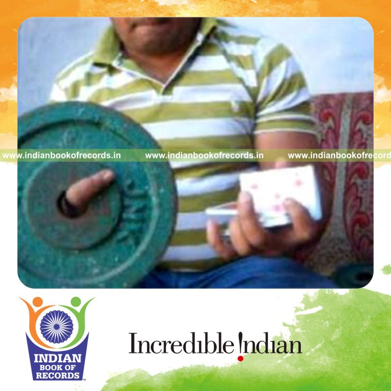 individual performing revolution 2 card cuts in one minute while holding weight plate for record in Indian Book of Records